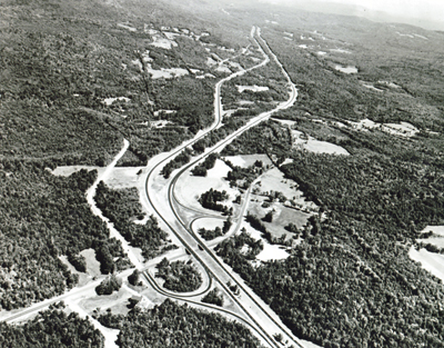 New Hampshire- Interstate Route 93 near Sanbornton, illustrates the use of independent roadway design and the preservation of trees on the roadside and in the median, for scenic effect and economy.