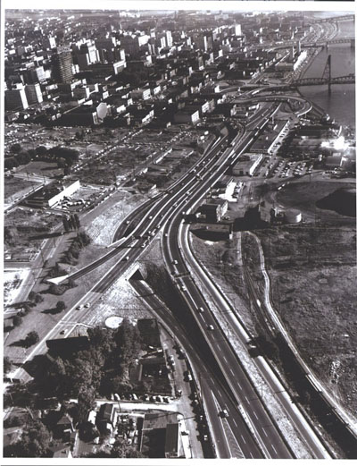 Oregon - A connecting link from Interstate Route 5 (on the right) joins Harbor Drive at the edge of downtown Portland.  An area prepared for urban re-development appears at the upper left.