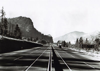 Oregon - Looking westerly from Hood River toward the Mitchell Point-Cascade Locks Section of I-80N(now I-84) recently opened to traffic.