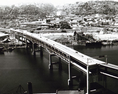 Oregon- The Marquan Bridge gives motorist in the Portland area direct and easy access to the Banfield, Baldock, and Stadium Freeways.  The opening of the bridge has reduced traffic congestion in this area considerably.  The uncompleted section of the span in lower right corner of picture will connect to the Mr. Hood Highway (US26) in the future.