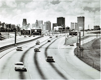 Texas- The towers of Houston rise over the North Freeway (I-45), presenting travelers with a stunning urban panorama.