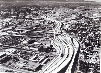 Work on this section of Interstate Routes 15 and 80, leading into Salt Lake City, Utah, from the north, began in 1958.  The elevated roadways leading off to the left are spur routes to the central city.  (Project I-15-7(23), (34), (46), & (51).)