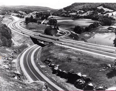 I-89 looking easterly up the Winooski River valley.  Interstate overpasses relocated US-2 in center of photograph, approximately 2 3/4 miles west of the village of Waterbury.