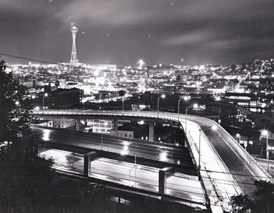 Seattle, Washington - tri-level section of I-5 near Lakeview Boulevard.  Space Needle towers above city's skyline.