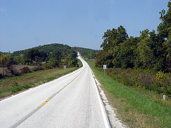 Highway recedes into distance.