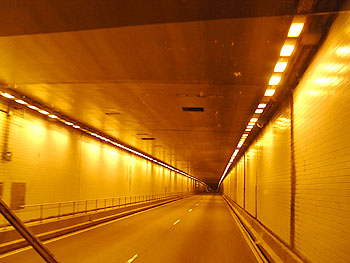 Inside of tunnel featuring amber lights.