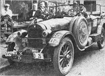 Charles H. Davis (left) standing beside his Hudson. The Hudson was decorated with the Number 25 License Plate from all the States and U.S. jurisdictions. 