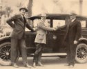 Major Bernard S. McMahan (center) arrives in San Diego on November 30 and is greeted by Mayor John L. Bacon (right) and Colonel Ed Fletcher, Vice President of Lee Highway Association.