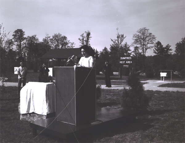 Lady Bird Johnson, speaking to participants in the Landscape-Landmark Tour and observers at the Dumfries Wayside Shelter on I-95 in northern Virginia, said, "No one can drive this scenic highway without feeling a deep sense of gratitude for such a lush, green land, and a rush of pride in man's increasing determination to keep it within eyesight of the motorist."