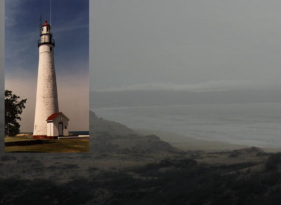 Foggy coast line with lighthouse
