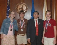On June 17, Secretary of Transportation Norman Y. Mineta congratulated Silver Medalists Tatum Holland, Justine Rice, and Brittany Rice (left to right) for their success in the National History Competition. Click for larger version of photo.