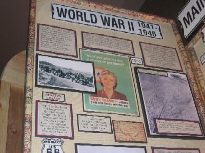 The left panel of the "Main Street of America" exhibit contains information about the role of Route 66 during World War II, noting that heavy use by military vehicles damaged the pavement.