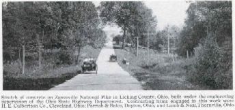 Two vehicles are shown on the concrete pavement of the National Old Trails Road in Licking County, Ohio.
