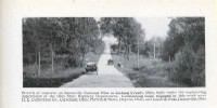 Two vehicles are shown on the concrete pavement of the National Old Trails Road in Licking County, Ohio.