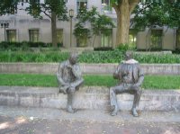 This statue of two men playing chess sits along a walk in Marshall Park, named after John Marshall, who served as Chief Justice of the U.S. Supreme Court from 1801 to 1835.  An unknown passerby placed a scarf around the neck of the man on the right.