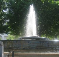 A fountain and statue honoring Andrew Mellon, Secretary of the Treasury from 1921 to 1932, are part of a mini-park at the intersection of Constitution and Pennsylvania Avenues.