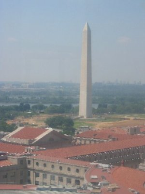 From the Bell Tower of the Old Post Office Building, a visitor has one of the best views of Washington, DC.  The Washington Monument is nearby, with the Lincoln Memorial just beyond it in this photograph.  Just beyond the Lincoln Memorial across the Potomac River is Arlington National Cemetery.  Arlington House is visible on the hill to the left of the Lincoln Memorial.