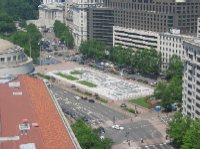 This photo, taken from the Bell Tower at the Old Post Office Building, shows Freedom Plaza along Pennsylvania Avenue.  The United States Treasury is seen at the top of the photo.  On the left, the circular structure sits atop the Ronald Reagan Building and International Trade Center.