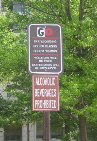 This sign near the Pulaski statue is supposed to warn visitors that "NO" skateboarding, roller blading, or roller skating is allowed in Freedom Plaza, but one of those visitors used a sticker to change the "NO" to "GO."
