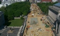 Pennsylvania Avenue from 15th to 17th Streets is being reconstructed, as shown here.  In the foreground, a statue of Albert Gallatin, a former Secretary of the Treasury (1801 to 1814), sits in front of the Treasury Building.  The top of White House is visible behind the line of trees.  (Photo courtesy Eastern Federal Lands Highway Division)