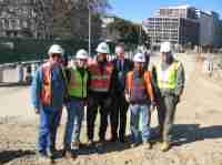 Former President George H. W. Bush visited the Pennsylvania Avenue construction zone in March 2004.  This photo was taken on Pennsylvania Avenue next to the west entrance to the White House.  From left to right:  Chris Dupont (consultant inspector), John Roddy (Project Manager for Lane Construction Company), Mike Tyree (FHWA), former President Bush, Jorge Alvarez (FHWA Project Engineer) and Gerald Rench (consultant inspector).  (Photo courtesy Eastern Federal Lands Highway Division.)