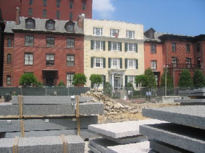 Blair House, the white building seen across the Pennsylvania Avenue construction zone, is operated by the Department of State as a residence for visiting foreign visitors.  It was built in 1824.  In 1950, a gun battle erupted on Pennsylvania Avenue in front of Blair House when Puerto Rican nationalists attempted to assassinate President Harry Truman.