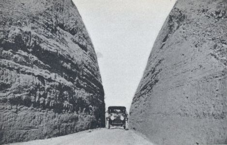 National Old Trails Road - Car in cut in Gravel Hill between Santa Fe and Algodones, NM