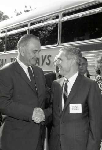 On May 11, 1965, President Lyndon B. Johnson greets Administrator Rex Whitton at the start of Lady Bird Johnson's 2-day Landscapes and Landmarks Tour of I-95 in Virginia to promote highway beautification.