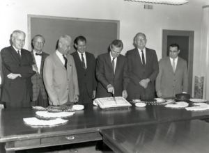 On July 11, 1966, leaders of the Bureau of Public Roads celebrate the 50th anniversary of the Federal Aid Road Act of 1916, which established the Federal-aid highway program. Left to right: James C. Allen (former Director of Administration), Charles D. "Cap" Curtis (former BPR Commissioner), E. H. "Ted" Holmes (Director of Planning), Lawrence Jones (Deputy Administrator), Rex Whitton (Administrator), George M. Williams (Director of Engineering and Operations), and Frank Turner (Chief Engineer).