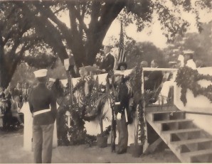 Dr. Johnson presents the Zero Milestone to the Government.  Beneath the flag, Mrs. Harding, on her left President Harding, on the President's left Henry Roberts, President of Lee Highway Association