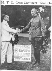 Just before the start of the transcontinental Army Convoy on July 7, 1919, Secretary of War Newton Baker (left) shook hands with Lt. Colonel Charles B. McClure, the convoy leader.  They are holding wreaths that Colonel McClure will present to California Governor William D. Stephens at journey's end.