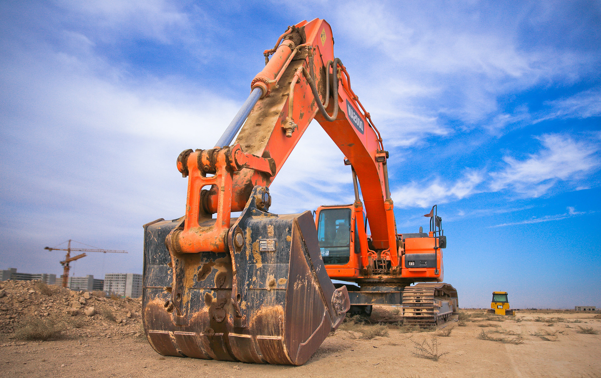 A large orange backhoe.