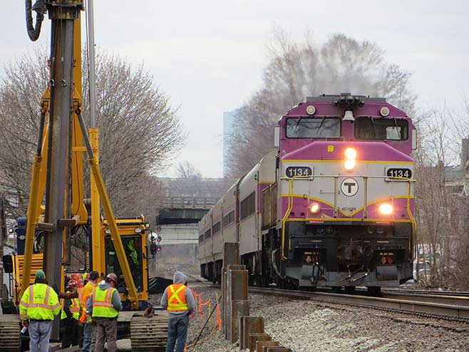 Photo of train and construction workers