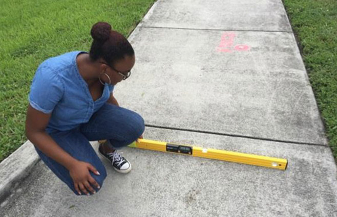 FHWA intern Jaelyn Williams participates in a demonstration of the Safe Accessible Pedestrian Facilities Inventory Model.
