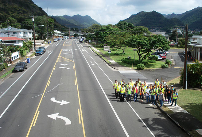 Workshop participants view a road diet installation in Honolulu.