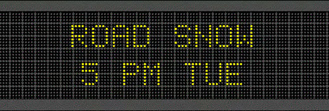 Photo of road ticker board displaying “Road Snow 5 PM TUE”