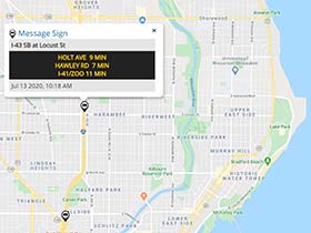 Digital map from Wisconsin 511 web platform with several icons indicating locations of dynamic message signs. One icon is blown up, showing message on sign indicating travel times to three locations.