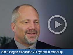 Close-up picture of man with play button overlayed on image. Text says, "Scott Hogan discusses 2D hydraulic modeling."