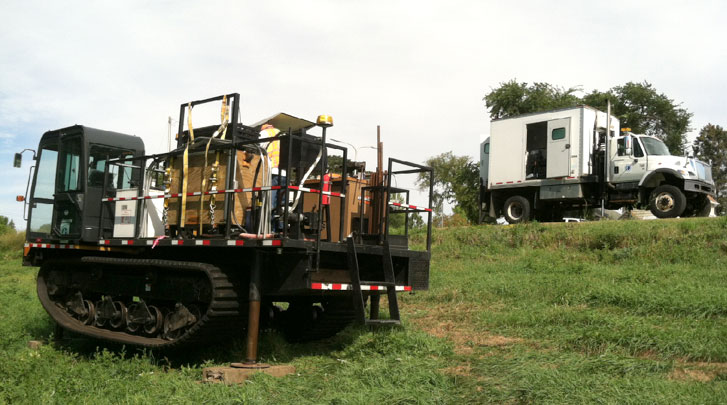 Piece of tracked equipment, at left, identified as a CPT rig.