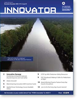 Innovator cover image- aerial photograph of flooded roadway with appearance of a river cutting through a wooded area.