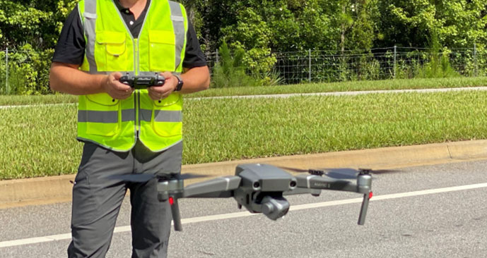 Man operating a small unmanned aerial system