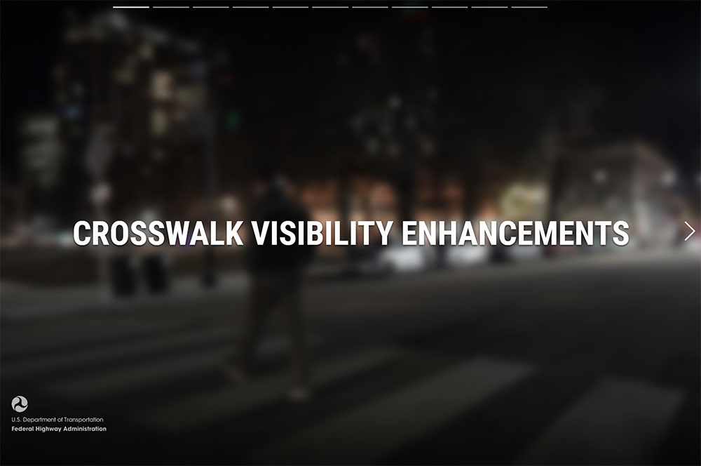 Screen capture of crosswalk visibility enhancement storyboard. The text, “crosswalk visibility enhancements” covers a blurred image of a person crossing at a darkened crosswalk.