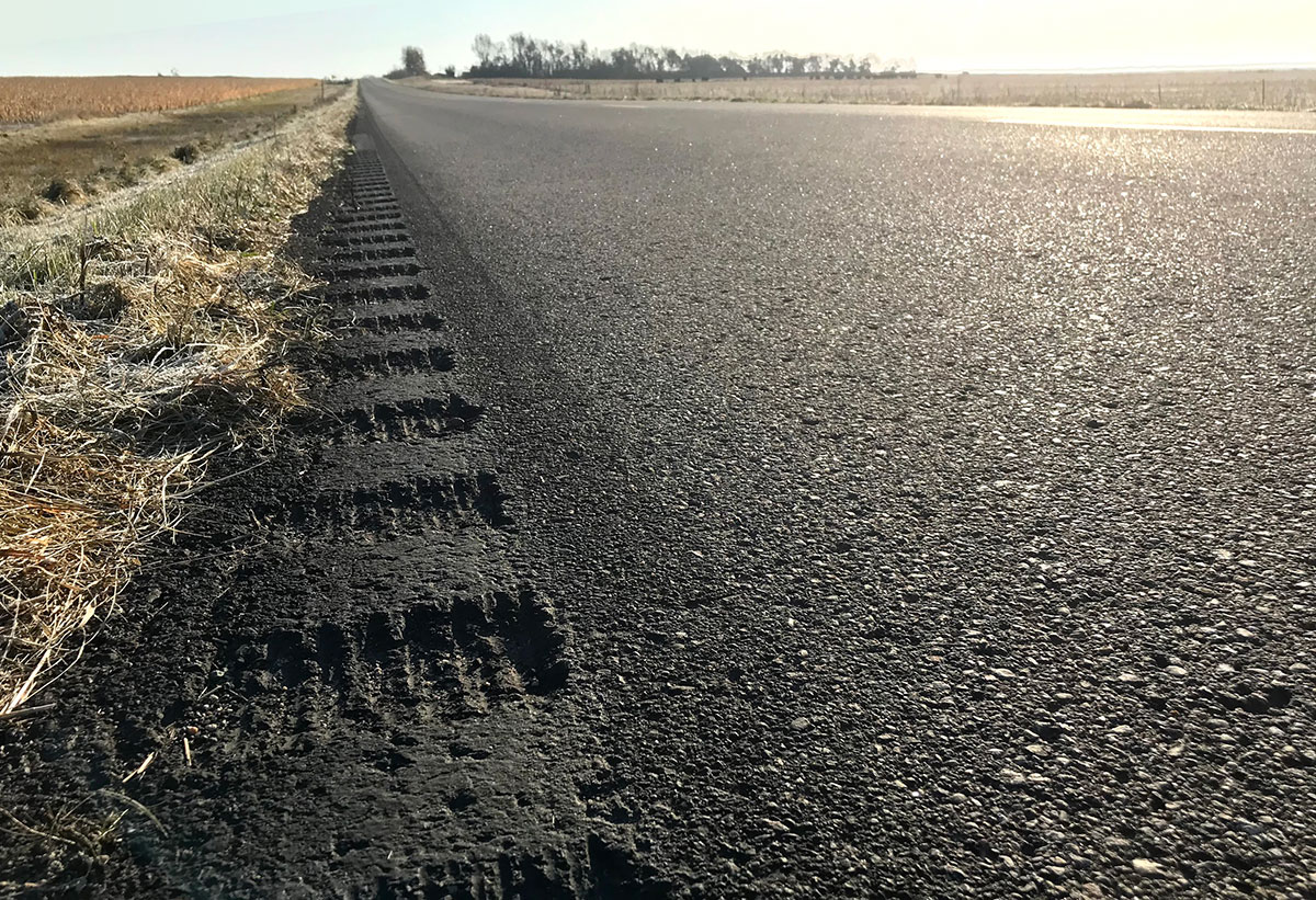 Close-up view of roadway edge with newly milled rumble strips.