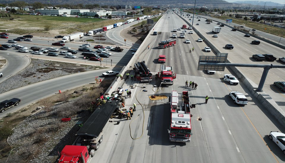 An aerial view of a traffic incident and first responders on-scene.