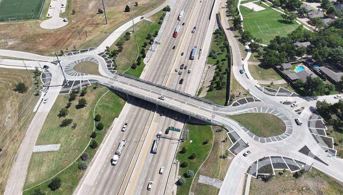 Aerial view of Allen, TX teardrop roundabout, which extends over another highway.