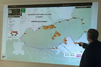 Presenter is pointing to screen to illustrate entry points to the GSMNP.