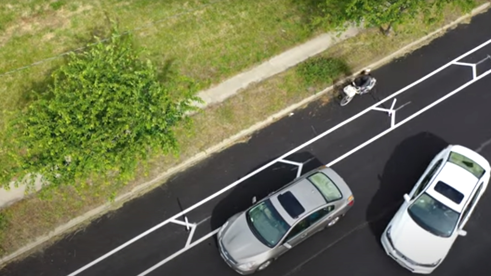 Overhead view of parking spaces and bike lanes