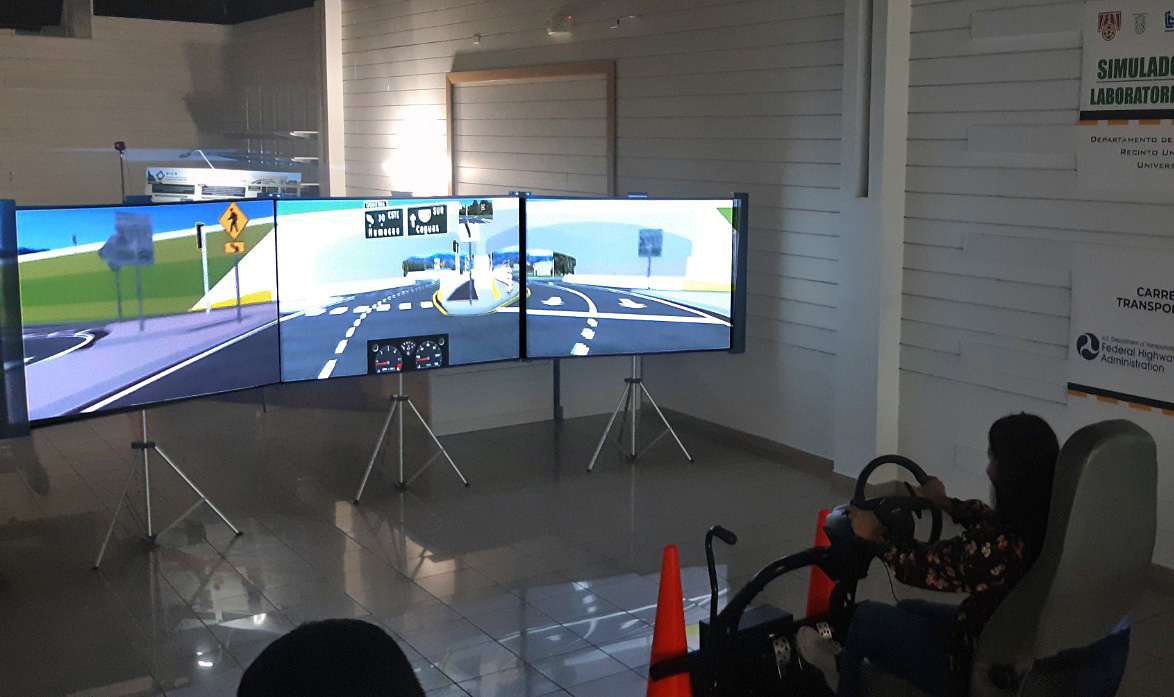 Lady demoing a driving simulator