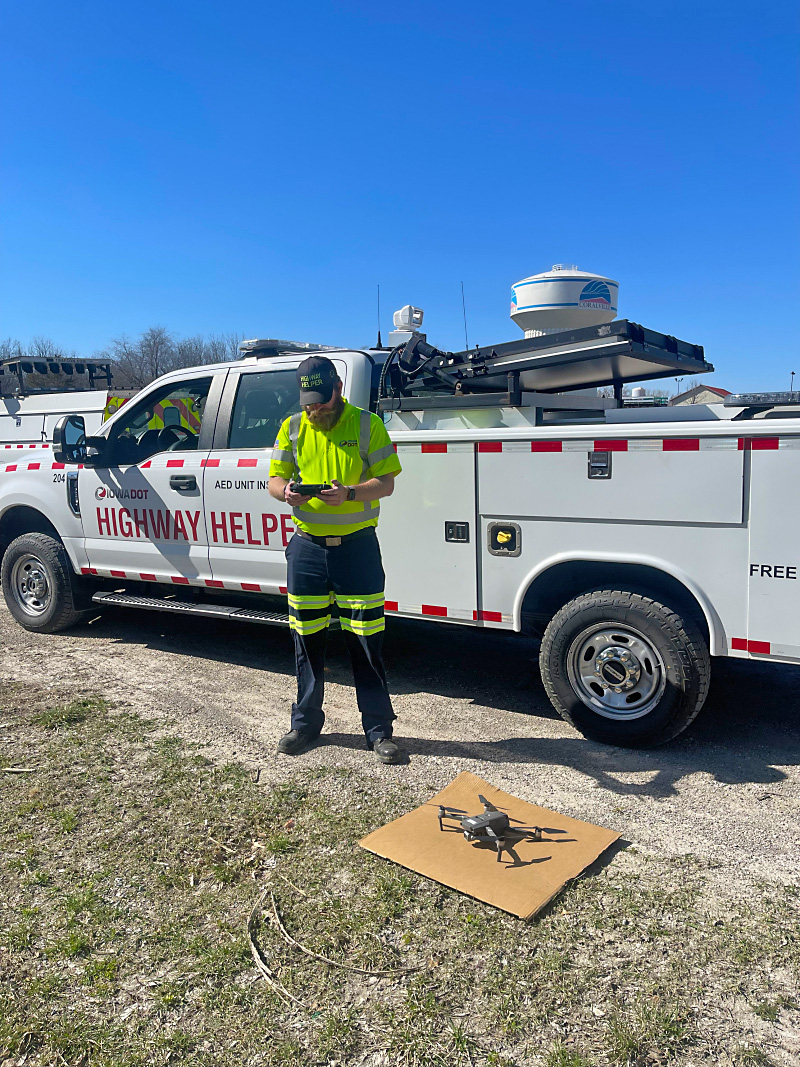 Highway worker getting ready to launch a drone to view the highway.