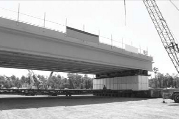 Black and white photograph depicting the Florida Department of Transportation used a prefabricated bridge, built adjacent to the work zone, to speed up replacement of a bridge over I-4.Black and white photograph depicting the Florida Department of Transportation used a prefabricated bridge, built adjacent to the work zone, to speed up replacement of a bridge over I-4.